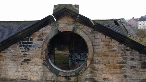 Aerial Drone exit mill in reverse - Old architecture portal building urban decay 動画素材 125037281