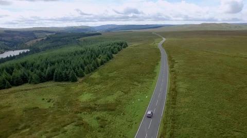 Aerial drone eye view of a road through countryside landscape Stock Footage 112387853