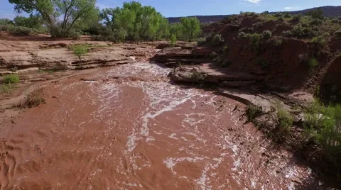Aerial drone filming of mud flash flood river in desert Video stock 60405770