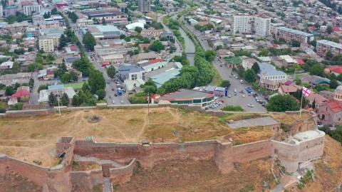 Aerial drone flies forward toward Gori Fortress in Georgia, approaching hilltop Stock Footage 340766017