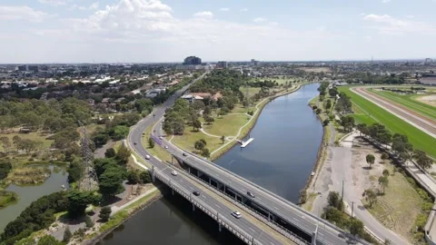 Aerial drone flies over two bridges crossing the Maribyrnong River in Footscray Stock Footage 309021554