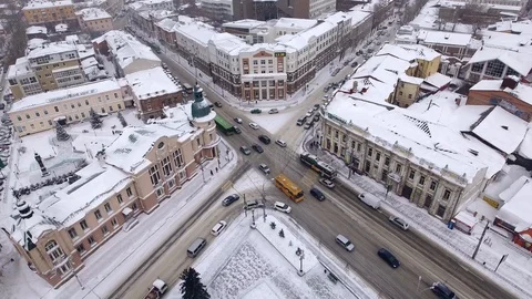 Aerial drone flight above central streets crossroads of winter Irkutsk. Video stock 88465014