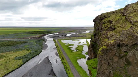 Aerial drone flight along dramatic cliffs beside Iceland Route 1, revealing Stock Footage 327473577