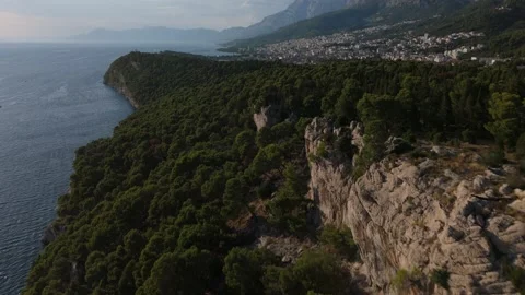 Aerial Drone Flight Along Osejava Forest Park Cliffs with Biokovo Mountains in B Video stock 320145937