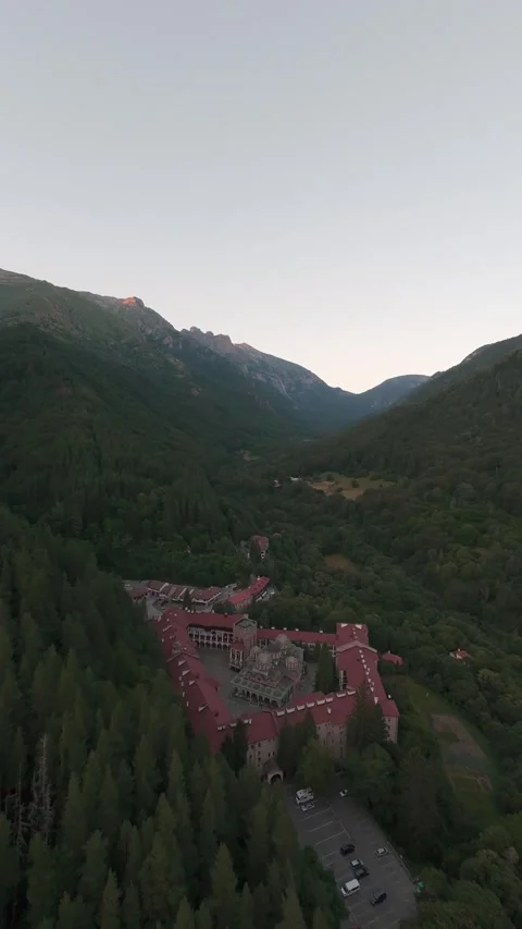 Aerial drone flight approaching Rila Monastery surrounded by forest in Bulgaria. 스톡 동영상 343418626