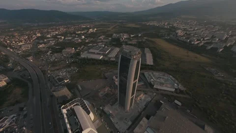 Aerial drone flight around a modern skyscraper at sunset in Sofia, Bulgaria. Stock Footage 340201223