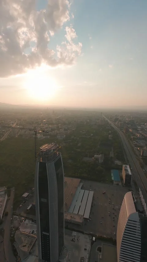 Aerial drone flight around modern skyscrapers at sunset in Sofia, Bulgaria, Stock Footage 340814703