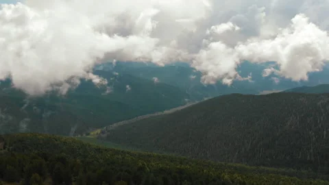 Aerial drone flight back in mountain region. valley between green mountains Stock Footage 200771528