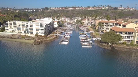 Aerial Drone flight into bay front homes and inlet docks - San Diego, CA Stock-Footage 88255488