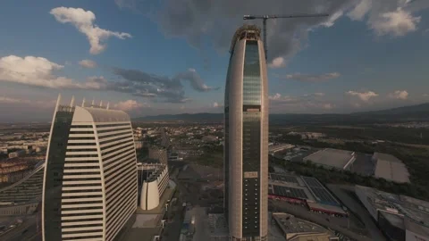 Aerial drone flight between modern skyscrapers at golden hour in Sofia, Bulgaria Stock Footage 340201296