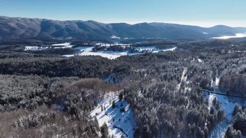 Aerial Drone Flight Between the snow Capped Mountains and the lake a breatht Video stock 274057177