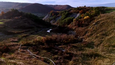 Aerial Drone Flight between Two Hills near Parajd, Harghita County, Transylvania Stock Footage 320935458