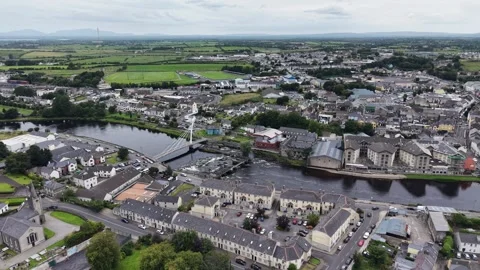 Aerial drone flight flying over a pedestrian white bridge in Ballina, Ireland. Stock Footage 343737493