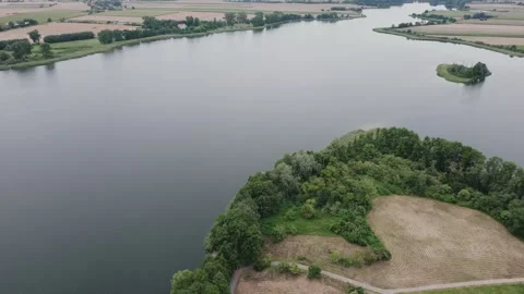 Aerial Drone Flight Forward and Tilt Up Over Lednica Lake Stock Footage 324976464