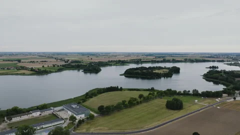 Aerial Drone Flight Forward Over Lednica Lake and Buildings Stock Footage 324975300