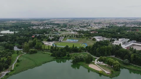 Aerial Drone Flight Forward Over Lake and Stadium in Gniezno Video stock 325814207