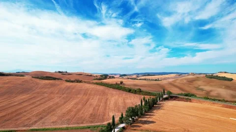 Aerial drone flight go on view Crete Senesi typical Tuscany panorama wheat field Stock Footage 226786746