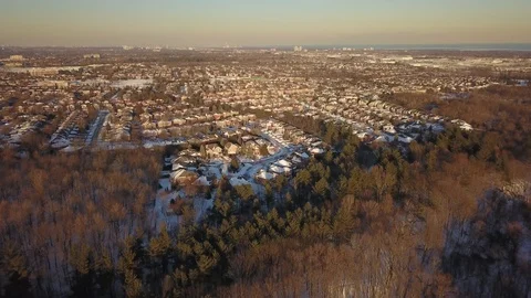 Aerial drone flight low over a suburban community on a bright day in winter. 스톡 동영상 102203310