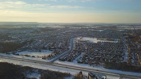 Aerial drone flight low over a suburban community on a bright day in winter. Stock Footage 102203418