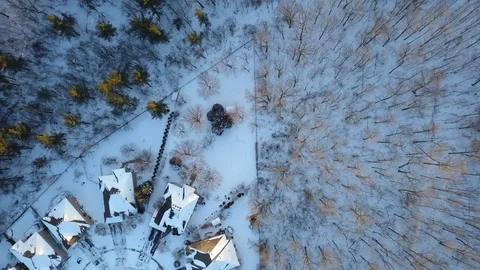 Aerial drone flight low over a suburban community on a bright day in winter. Stock Footage 102203571