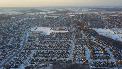 Aerial drone flight low over a suburban community on a bright day in winter. Video stock 102203841