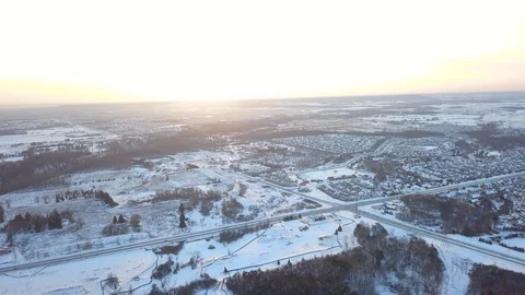 Aerial drone flight low over a suburban community on a bright day in winter. Stock Footage 102204147