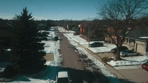 Aerial drone flight low over a suburban community on a bright day in winter Stock-Footage 103061554