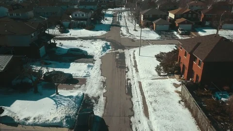 Aerial drone flight low over a suburban community on a bright day in winter Stock-Footage 103061677