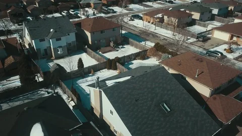 Aerial drone flight low over a suburban community on a bright day in winter Stock-Footage 103062020