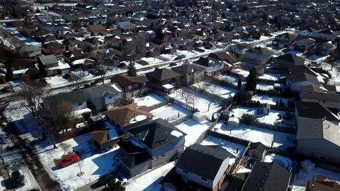 Aerial drone flight low over a suburban community on a bright day in winter. Stock Footage 103062218