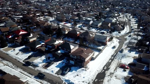 Aerial drone flight low over a suburban community on a bright day in winter. Stock Footage 103062261