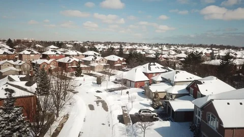 Aerial drone flight low over a suburban community on a bright day in winter. Stock-Footage 103824486