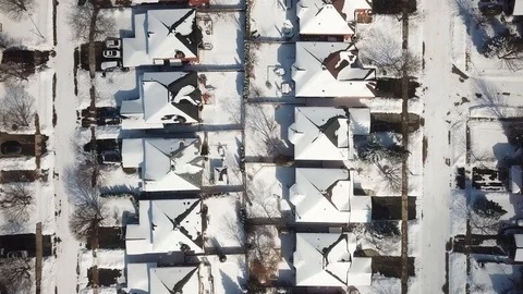 Aerial drone flight low over a suburban community on a bright day in winter. Stock Footage 103824510