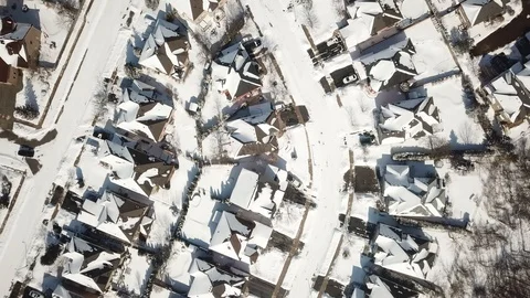 Aerial drone flight low over a suburban community on a bright day in winter. Stock-Footage 103824595