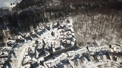 Aerial drone flight low over a suburban community on a bright day in winter. Video stock 103824645