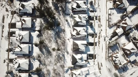 Aerial drone flight low over a suburban community on a bright day in winter. Stock-Footage 103824682