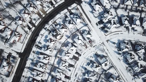 Aerial drone flight low over a suburban community on a bright day in winter. Stock-Footage 103824829