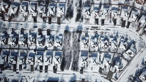 Aerial drone flight low over a suburban community on a bright day in winter. Stock Footage 103824904