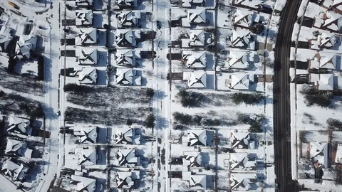 Aerial drone flight low over a suburban community on a bright day in winter. Stock-Footage 103824975