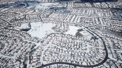Aerial drone flight low over a suburban community on a bright day in winter. Stock-Footage 103825151