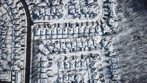 Aerial drone flight low over a suburban community on a bright day in winter. Video stock 103825155