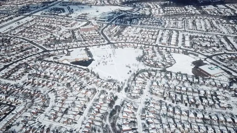 Aerial drone flight low over a suburban community on a bright day in winter. Stock-Footage 103825178