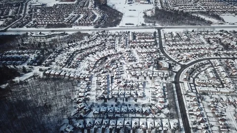 Aerial drone flight low over a suburban community on a bright day in winter. Stock-Footage 103825237