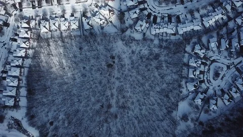 Aerial drone flight low over a suburban community on a bright day in winter. Stock-Footage 103825271