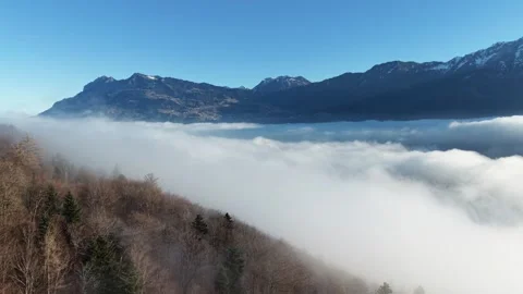 Aerial drone flight moving forward above dense fog 스톡 동영상 329557774