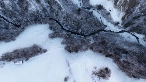 Aerial drone flight moving over a snowy gorge in Switzerland 스톡 동영상 329557775