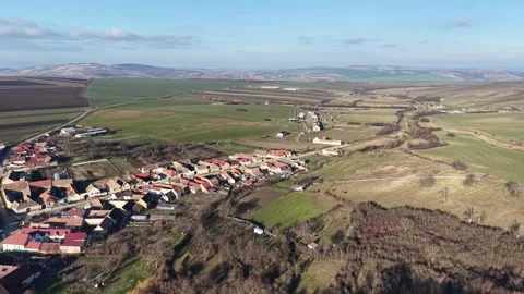 Aerial drone flight moving sideways toward a street in Romania 스톡 동영상 329557777