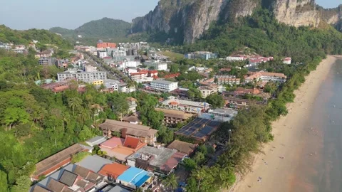 Aerial drone flight over Ao Nang town revealing limestone mountains and beach Vídeos de archivo 333864607
