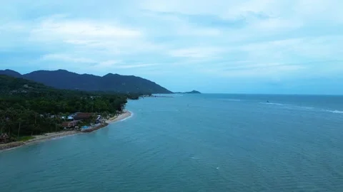 Aerial Drone Flight Over Baan Tai Beach with Kitesurfers and Tropical Coastl Stock Footage 339382811