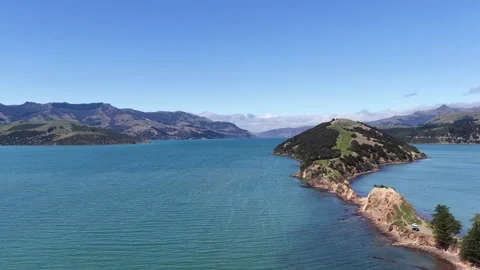 Aerial Drone Flight Over Blue Bay and Green Peninsula, South Island New Zealand Video stock 337788457